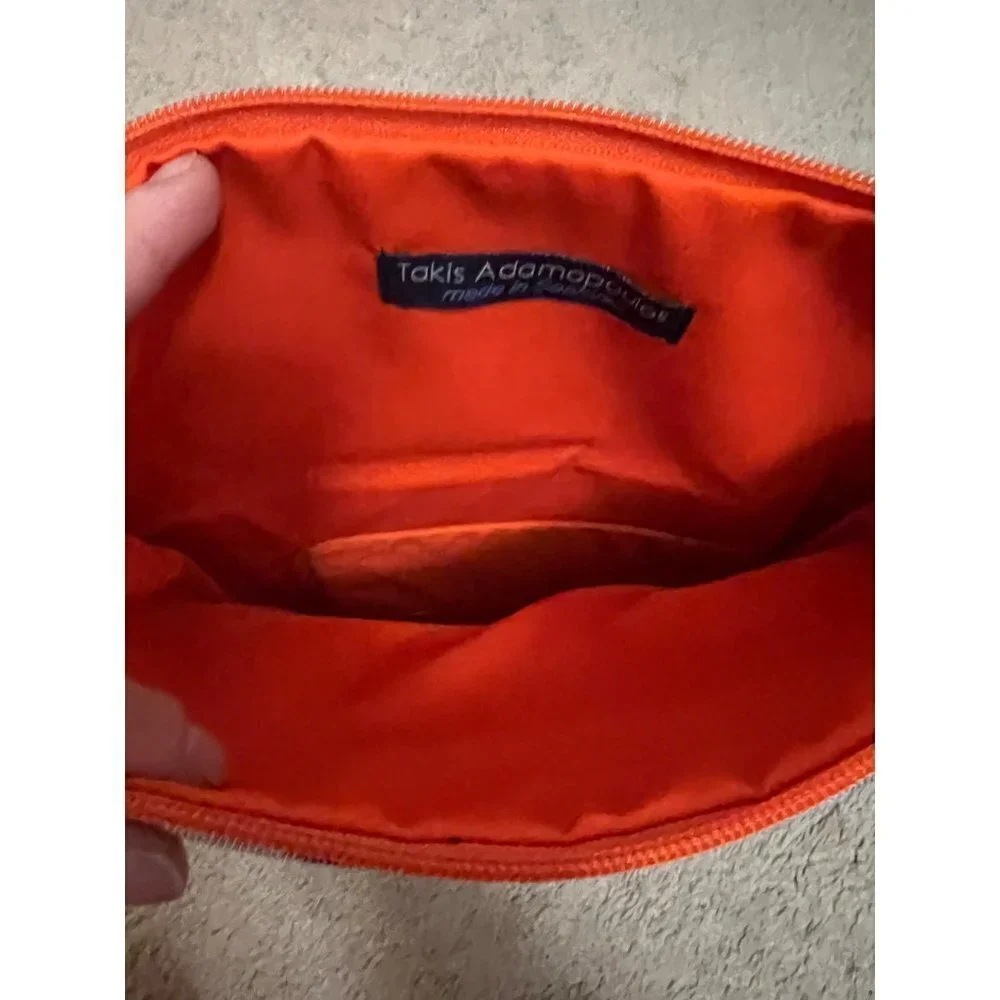 Takis Adamopoulos beautiful clutch